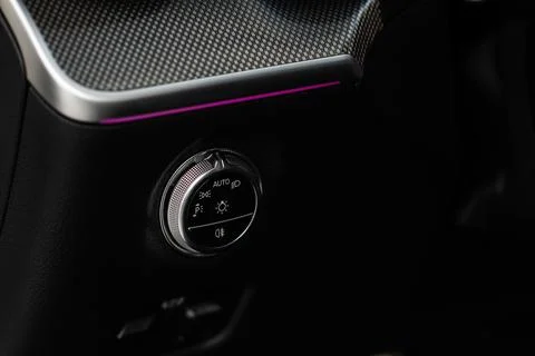 Closeup of the headlight switch control button. Lights control panel in car Stock Photos