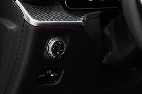 Closeup of the headlight switch control button. Lights control panel in car Foto stock