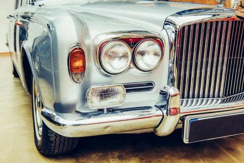 Closeup of the headlights and front bumper on  vintage automobile Stock Photos
