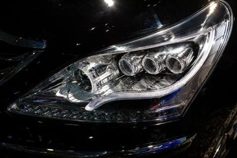 Closeup headlights of car.modern light element Stock Photos