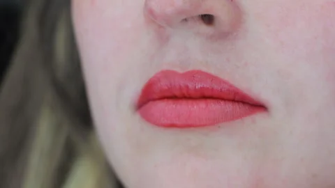 Closeup of healed lips after permanent makeup, smooth red tone and well-defined Stock Footage 308496635