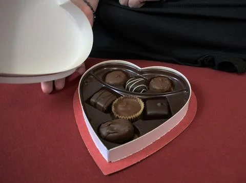 Closeup heart box of chocolates Stock Photos