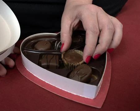 Closeup heart box of chocolates Stock Photos