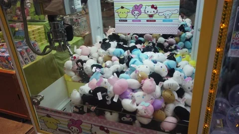 Closeup of Hello Kitty and Sanrio Plush Toys Inside Japanese Arcade Claw Vídeos de archivo 345940478