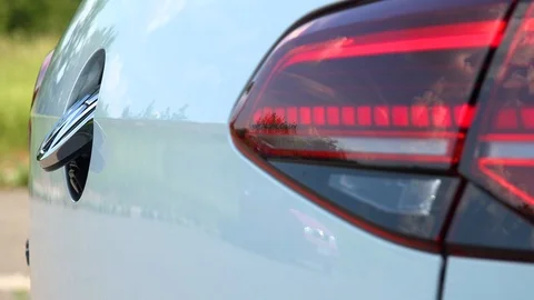 Closeup on a hidden reverse parking camera on a Volkswagen car Stock Footage 92407333