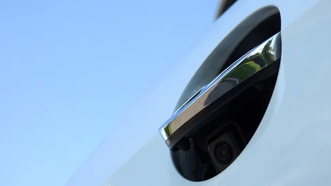 Closeup on a hidden reverse parking camera on a Volkswagen car Stock Footage 92435949