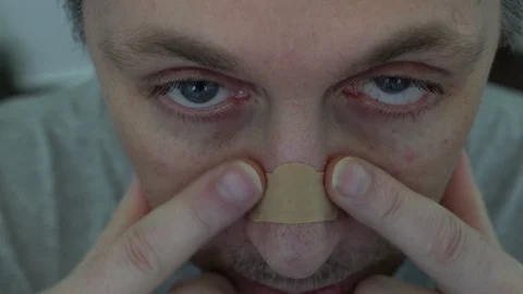 Closeup High Angle Man with Nasal Strip Stock Footage 92924474