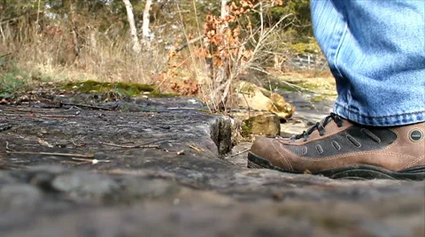 Closeup of hikers shoes walking on a trail. Stock Footage
