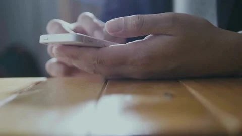 Closeup holding cell phone using smartphone mobile apps scrolling in smart .. Stock Footage 272781400