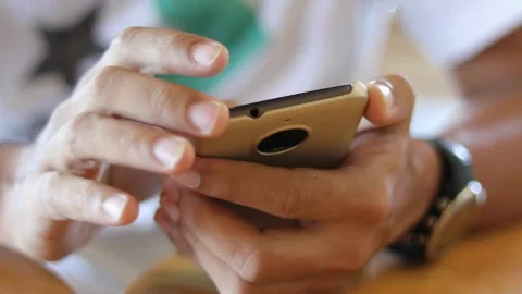 Closeup holding cell phone using smartphone mobile apps scrolling in smart phone Stock Footage 336249028