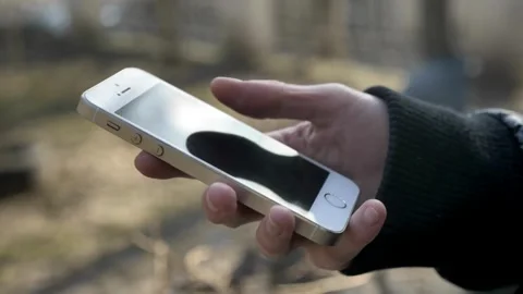 Closeup holding cell phone using smartphone mobile apps scrolling in smart phone Stock-Footage 336249835