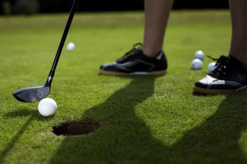 Closeup of hole on golf field Stock Photos