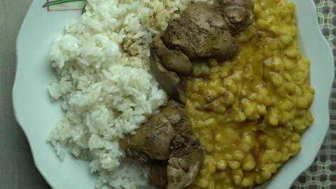 Closeup homemade panamito bean with liver and rice viewed from above Stock-Footage 140136053