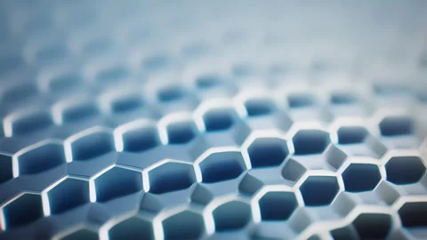 Closeup of a honeycomb textured plastic, with small geometric shapes Vidéo 253928754
