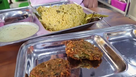 A closeup of hot methi pulao or fenugreek rice served on a plate Stock Footage 232714103