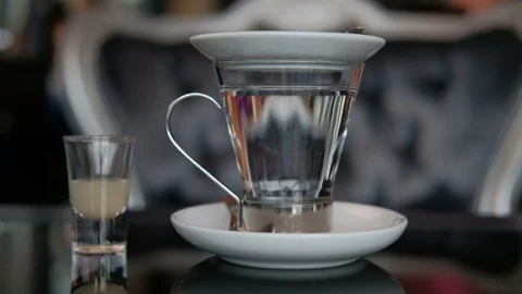 Closeup hot water in cup for tea and lemon juice in the table at cafe Stock Footage 87763804