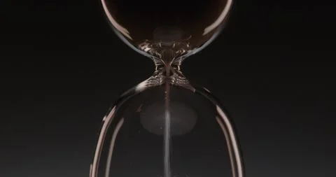 Closeup of hourglass over a dark dramatic background. Stock Footage 327145770