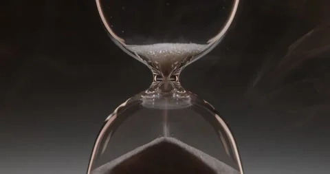 Closeup of hourglass over a dark dramatic background. Stock Footage 327145800