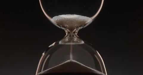 Closeup of hourglass over a dark dramatic background. Stock Footage 327145823