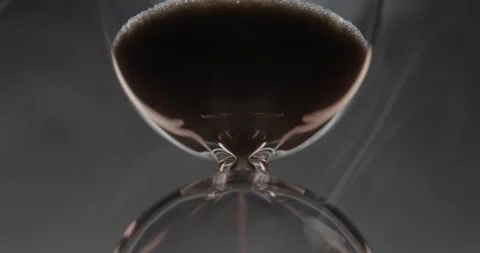 Closeup of hourglass over a dark dramatic background. Stock Footage 327146055