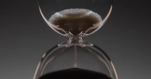 Closeup of hourglass over a dark dramatic background. Stock Footage 327146112