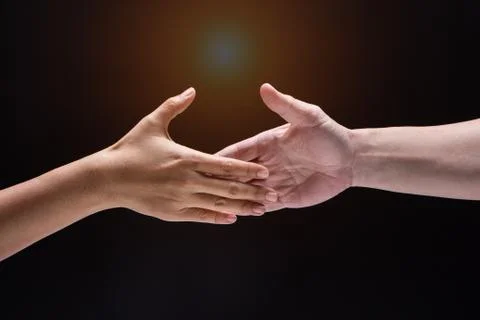Closeup human hand ,between mand and woman.they are reaching to touch togethe Foto stock