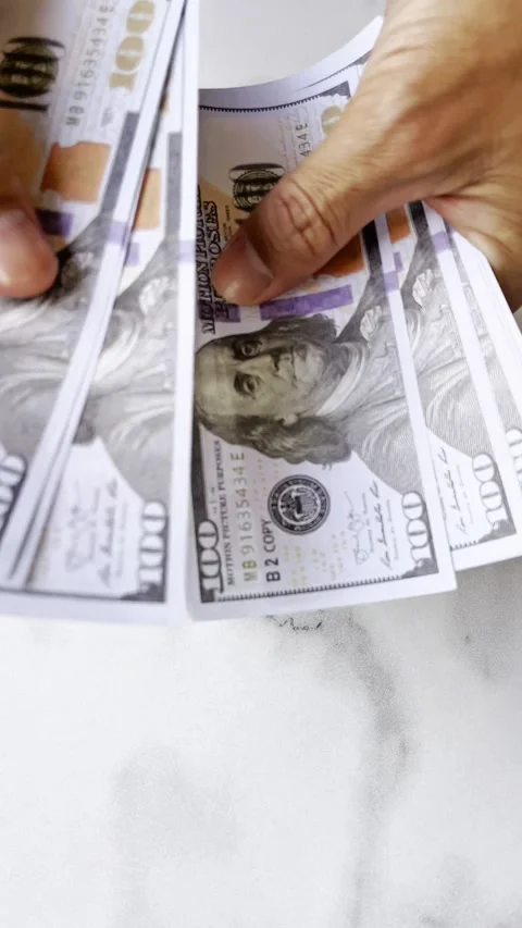 Closeup of human hands counting dollar banknotes Stock-Footage 345557787