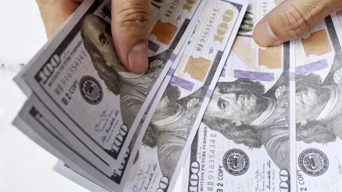 Closeup of human hands counting dollar banknotes. Stock-Footage 345557880