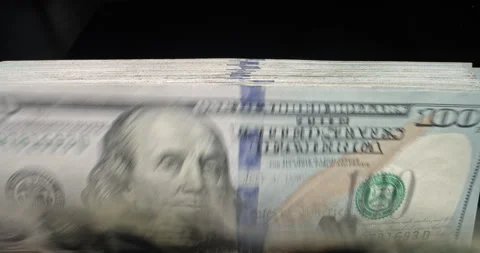 Closeup of hundred dollar bill banknotes flipping through in counting machine Stock-Footage 251979614