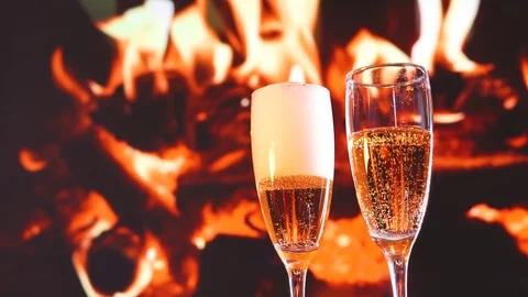 Closeup image of air bubbles and foam in two glasses of champagne, valentines Stock Footage 100610940