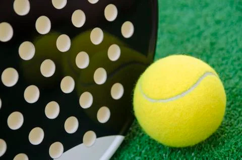 Closeup image of ball and paddle tennis racket Stock Photos