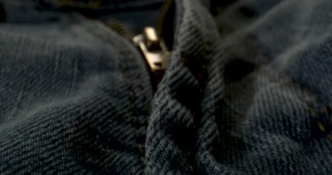 Closeup Image Of Distressed Denim Zipper Highlighting Metallic Features And Tact 스톡 동영상 335579278