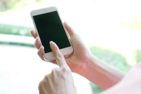Closeup image of a female hands using smartphone Stock Photos