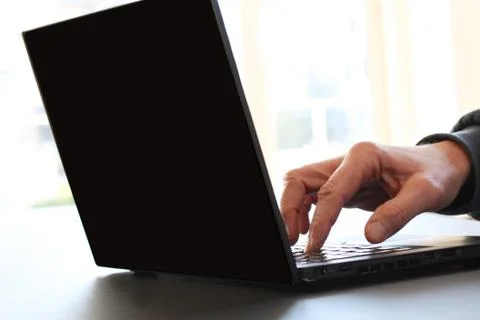 Closeup image of a finger touching texting on keyboard on a laptop computer. Foto stock