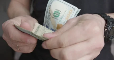 CloseUp Image of Hands Counting Cash and Banknotes in Detail Stock Footage 303978241