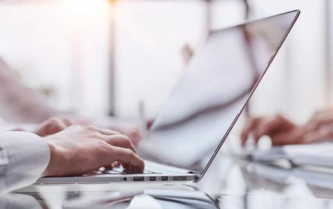 Closeup image of hands using and typing on laptop Stock Photos