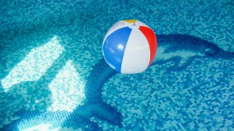 Closeup image of inflatable beach ball in swimming pool. Perfect image to Photos