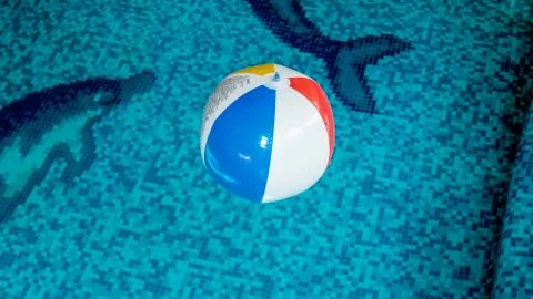 Closeup image of inflatable beach ball in swimming pool. Perfect image to Photos