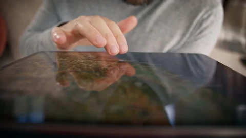 A CloseUp Image of a Man Effectively Using a Tablet for Navigation Purposes Stock Footage 284903624
