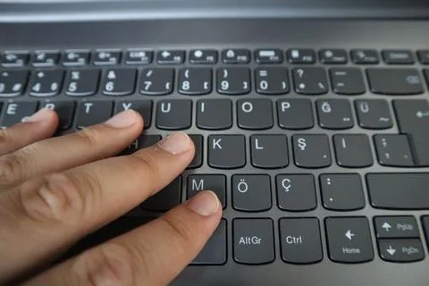 Closeup image of man hand working and touching on laptop computer keyboard Stock Photos