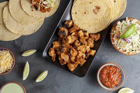 Closeup image of a Mexican taco dish with corn tortillas, precooked, preseaso Stock Photos