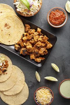 Closeup image of a Mexican taco dish with corn tortillas, precooked, preseaso Stock Photos