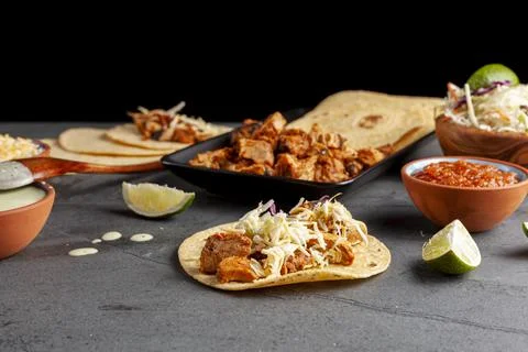 Closeup image of a Mexican taco dish with corn tortillas, precooked, preseaso Stock Photos