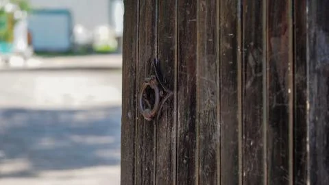 Closeup image of old door with circle iron door-handle Stock Photos