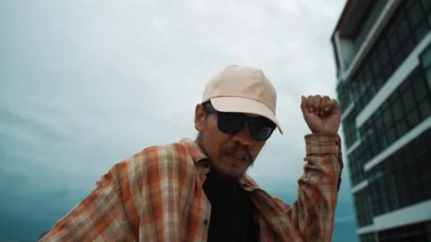 Closeup image of profession hipster dancing break dance at rooftop. Endeavor. 写真素材