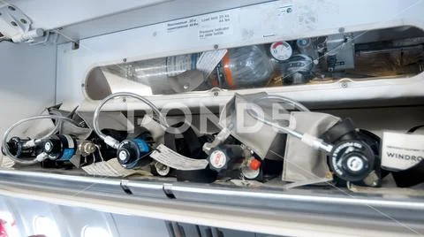 Closeup image of safety systems in case of emergency on passenger airplane Stock Photos