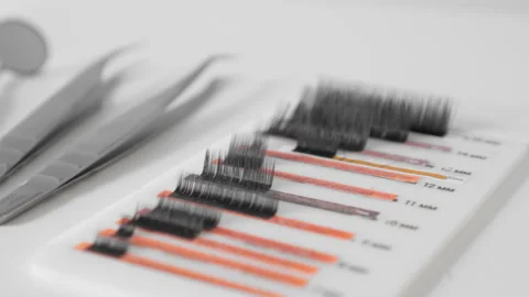 CloseUp image showing professional lash extensions, tweezers, and other beauty Stock-Footage 284711040