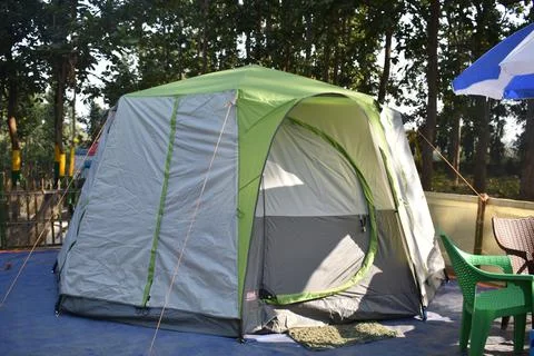 Closeup image of a tent in between a forest Stock Photos