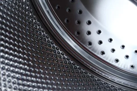 Closeup image of washing machine, abstract metallic texture background Stock Photos