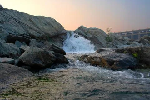 Closeup image of water flowing between the rocks Stock Photos